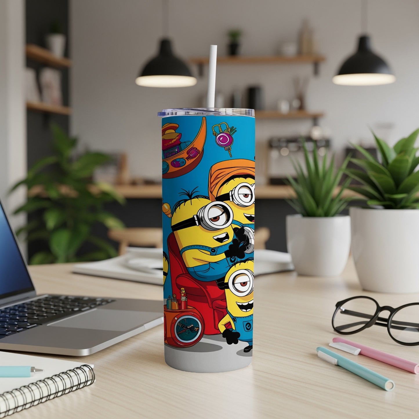 Minions Stuart, Kevin, and Bob on a blue travel tumbler with a backpack and accessories.