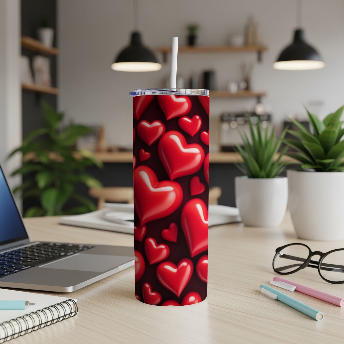 Red heart pattern on a white tumbler with a straw.
