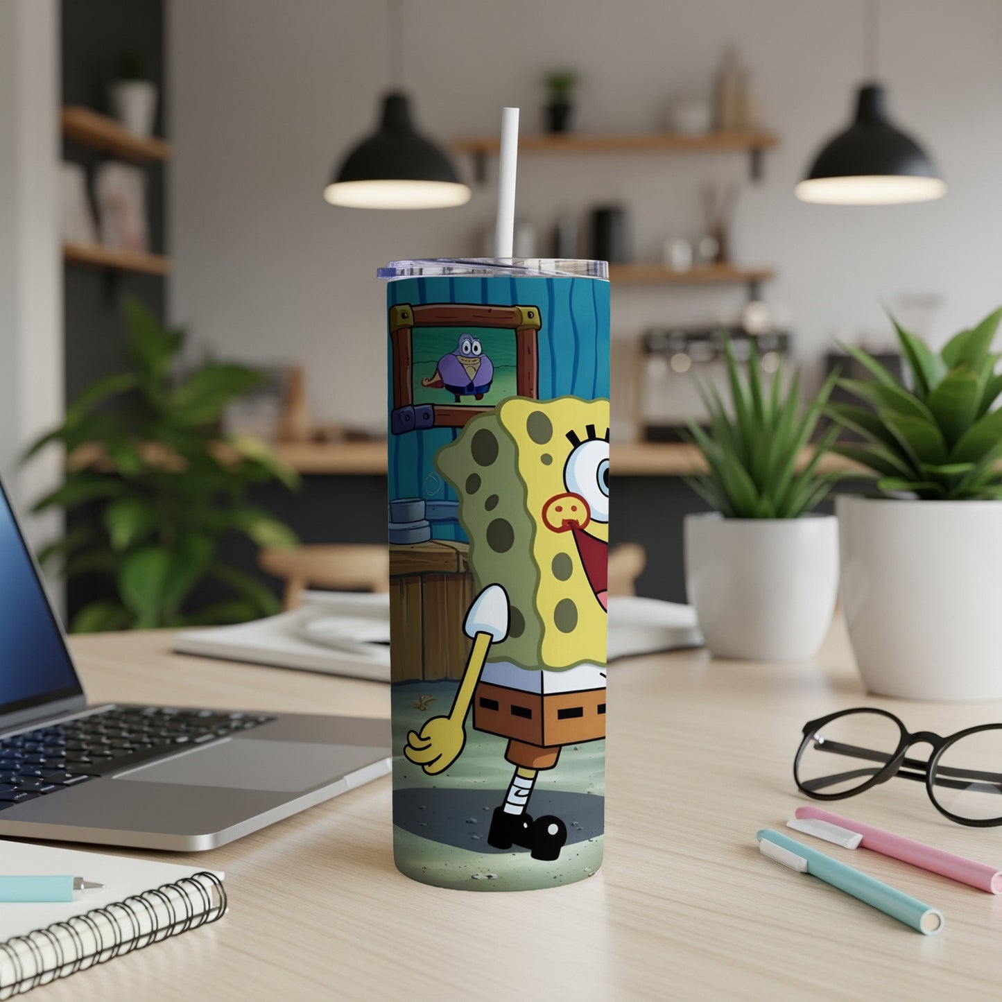 SpongeBob SquarePants character illustration on a tall tumbler with straw.