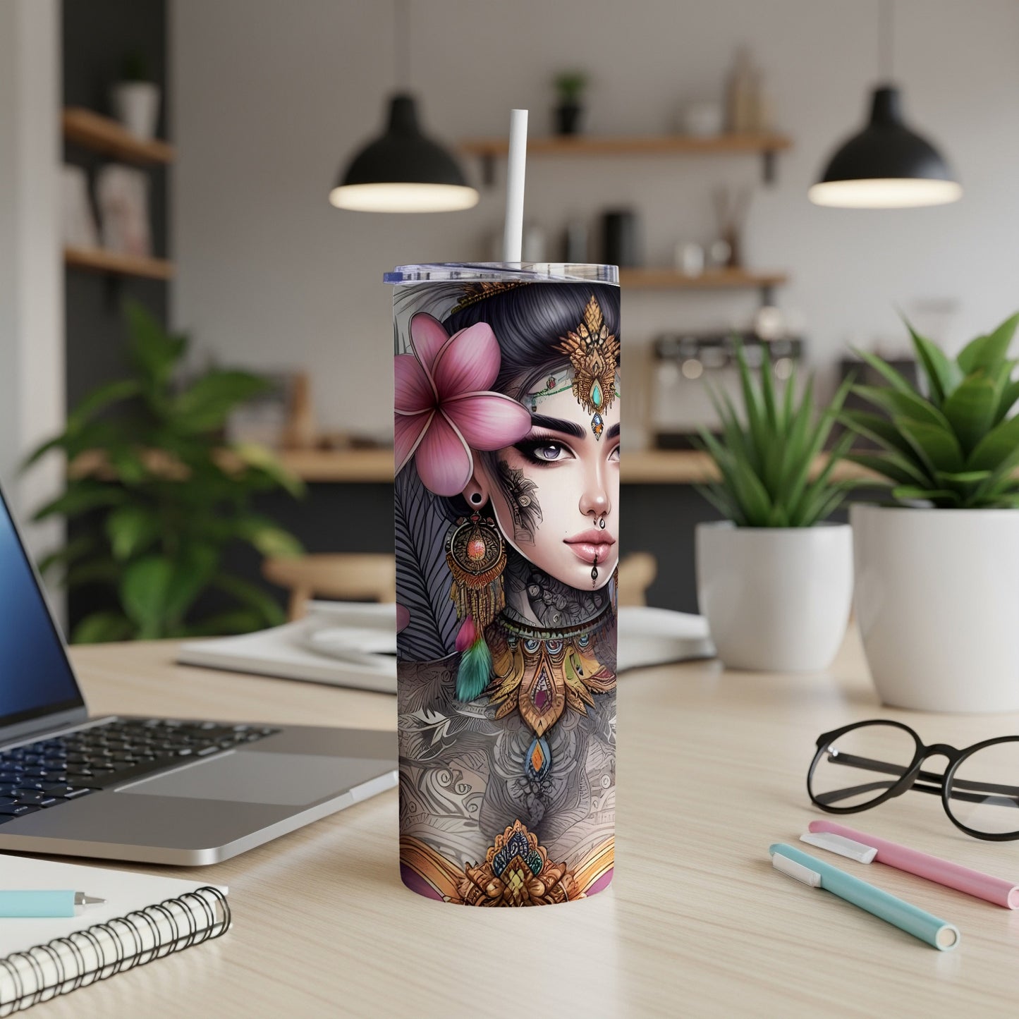 Tumbler featuring a woman's face with ornate tattoos and a large pink flower.