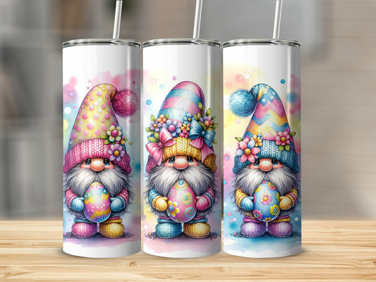 Three gnomes in colorful hats hold Easter eggs.