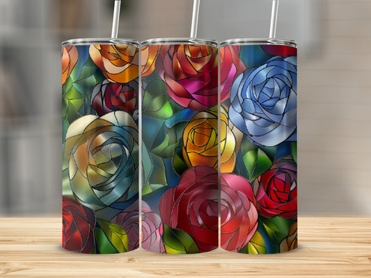 Three tumblers with stained glass rose patterns on a wooden surface.