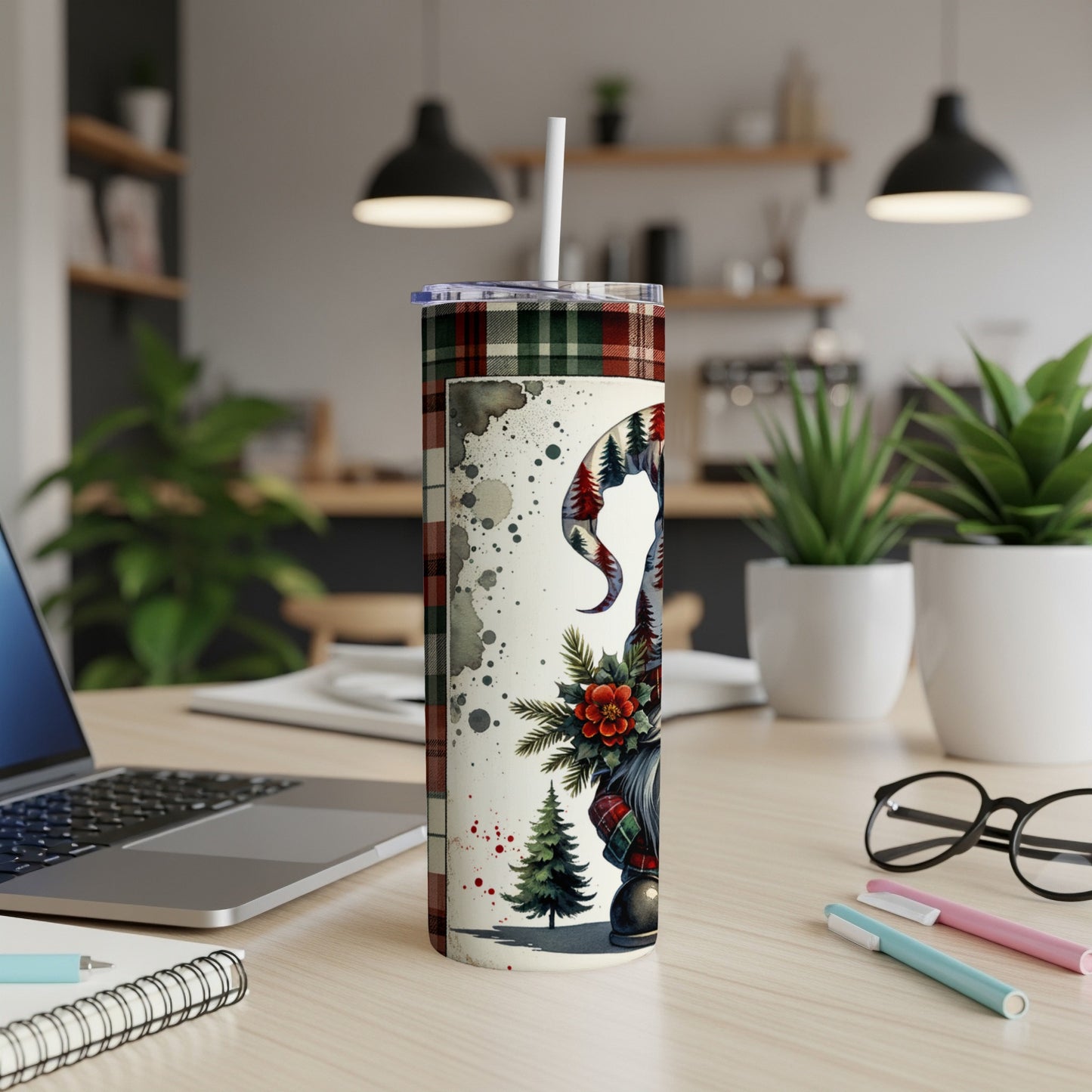 White tumbler with gnome, pine trees, and plaid pattern.