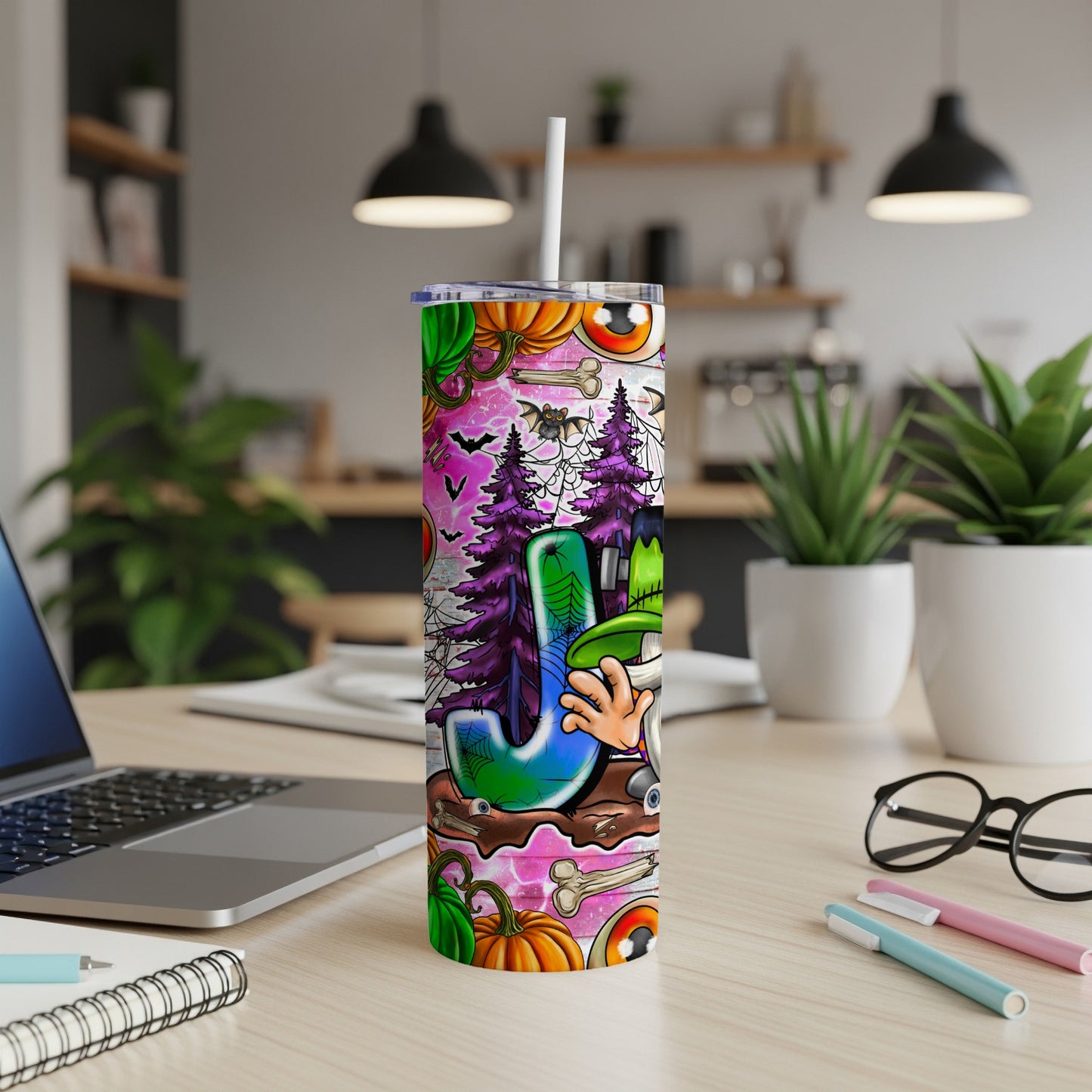 Tumbler with "J" and Halloween graphics including pumpkins, eyeballs, and bats.