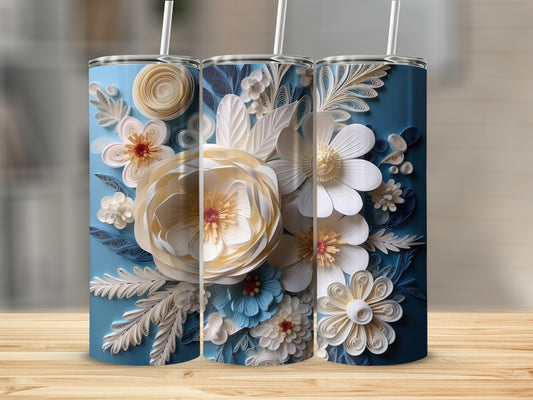Three blue tumblers with intricate white and blue floral paper art designs.