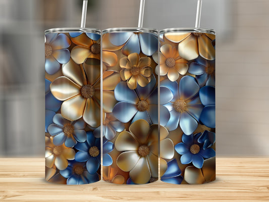 Three tumblers with floral designs in blue and gold hues.