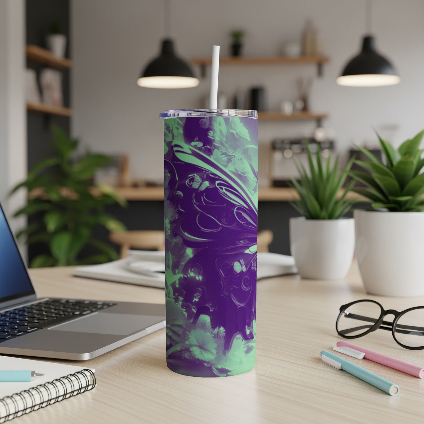 Purple and green abstract swirl pattern on a tumbler with a straw.