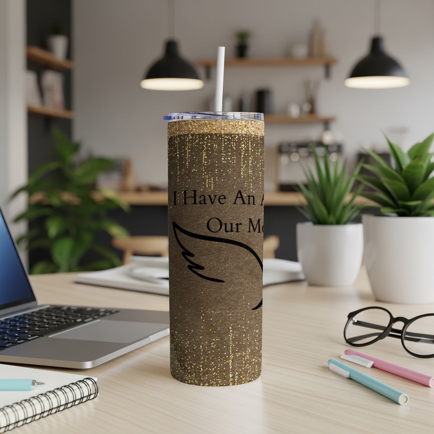 Brown glitter tumbler with "I Have An Angel" text and wing design.