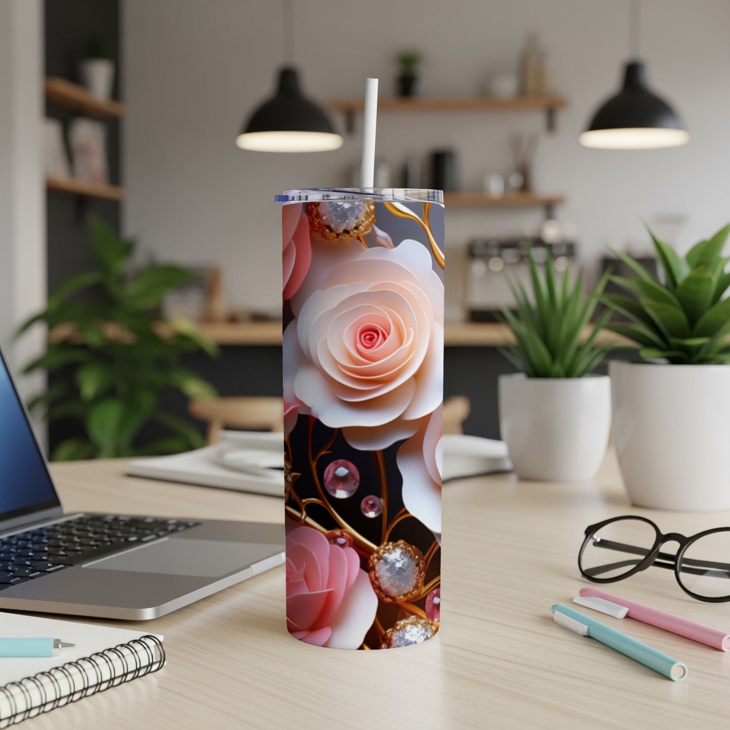 Pink and white roses with gold accents on a black background on a tumbler.