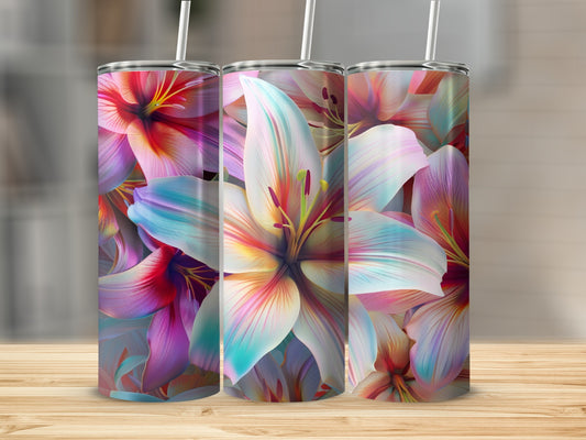 Three tumblers with colorful lily flower designs on a wooden surface.