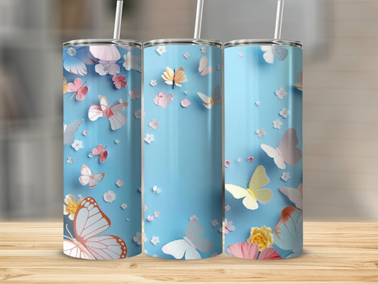 Light blue tumbler with colorful butterflies and floral accents.