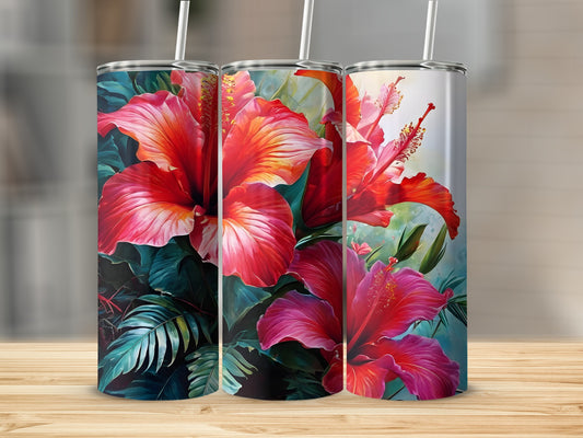 Three tumblers with vibrant red hibiscus flowers and green leaves.