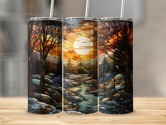 Three tumblers featuring a stained-glass style sunset over a forest stream.