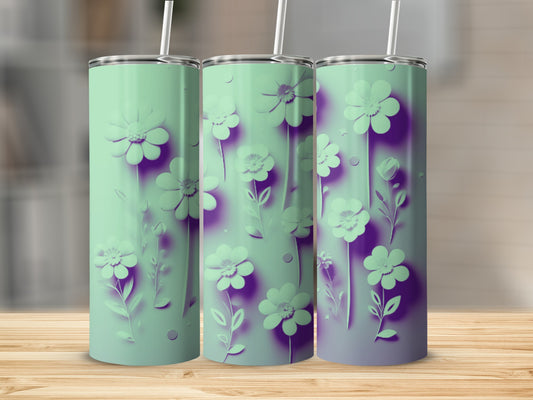 Three mint green tumblers with purple floral designs displayed on a wooden surface.