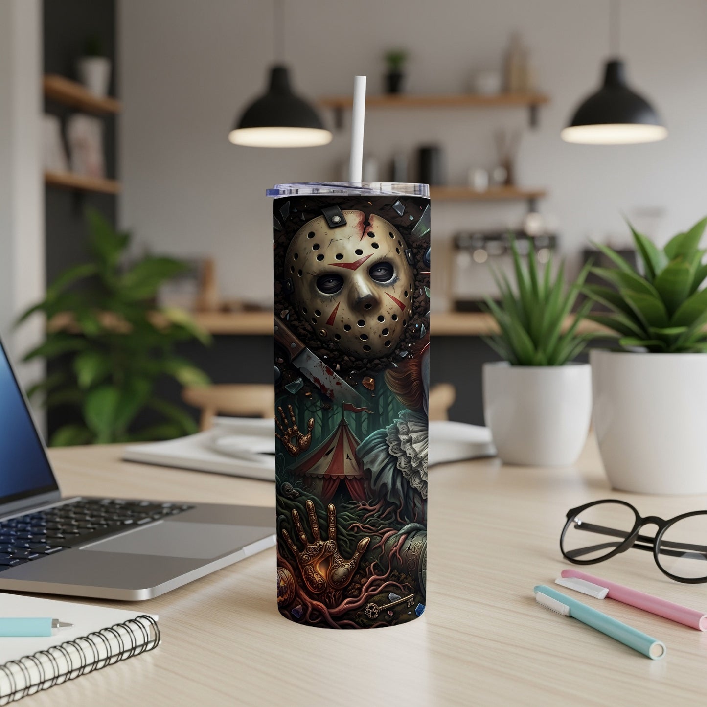 Tumbler with Jason Voorhees mask and horror movie characters, on a desk.