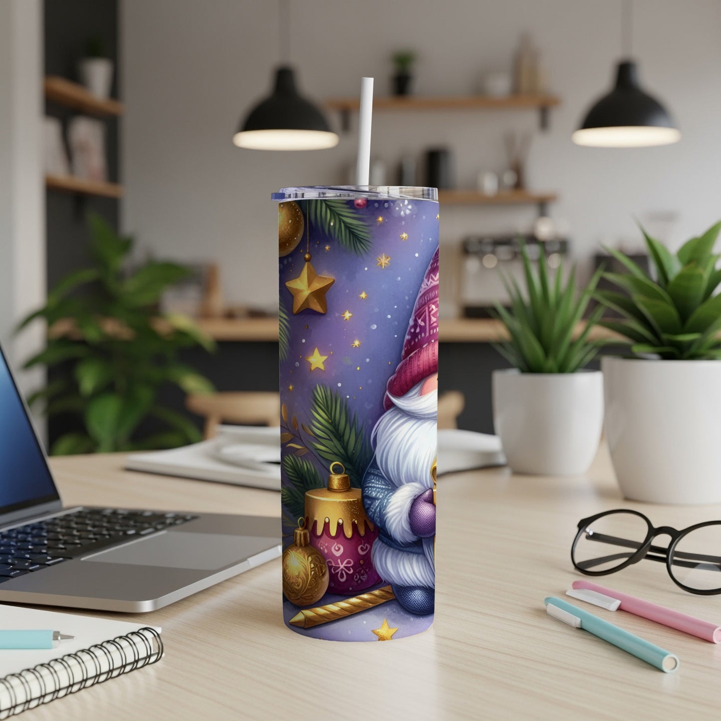 Gnome tumbler with Christmas ornaments and stars, on a desk.
