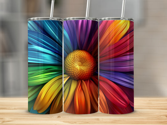 Three tumblers with colorful abstract flower petals and straws.