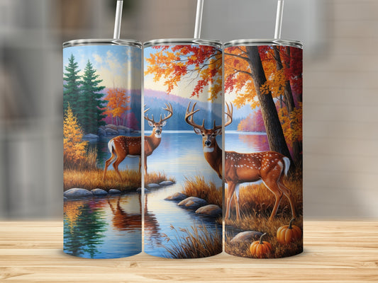 Two deer by a lake with autumn trees and pumpkins.