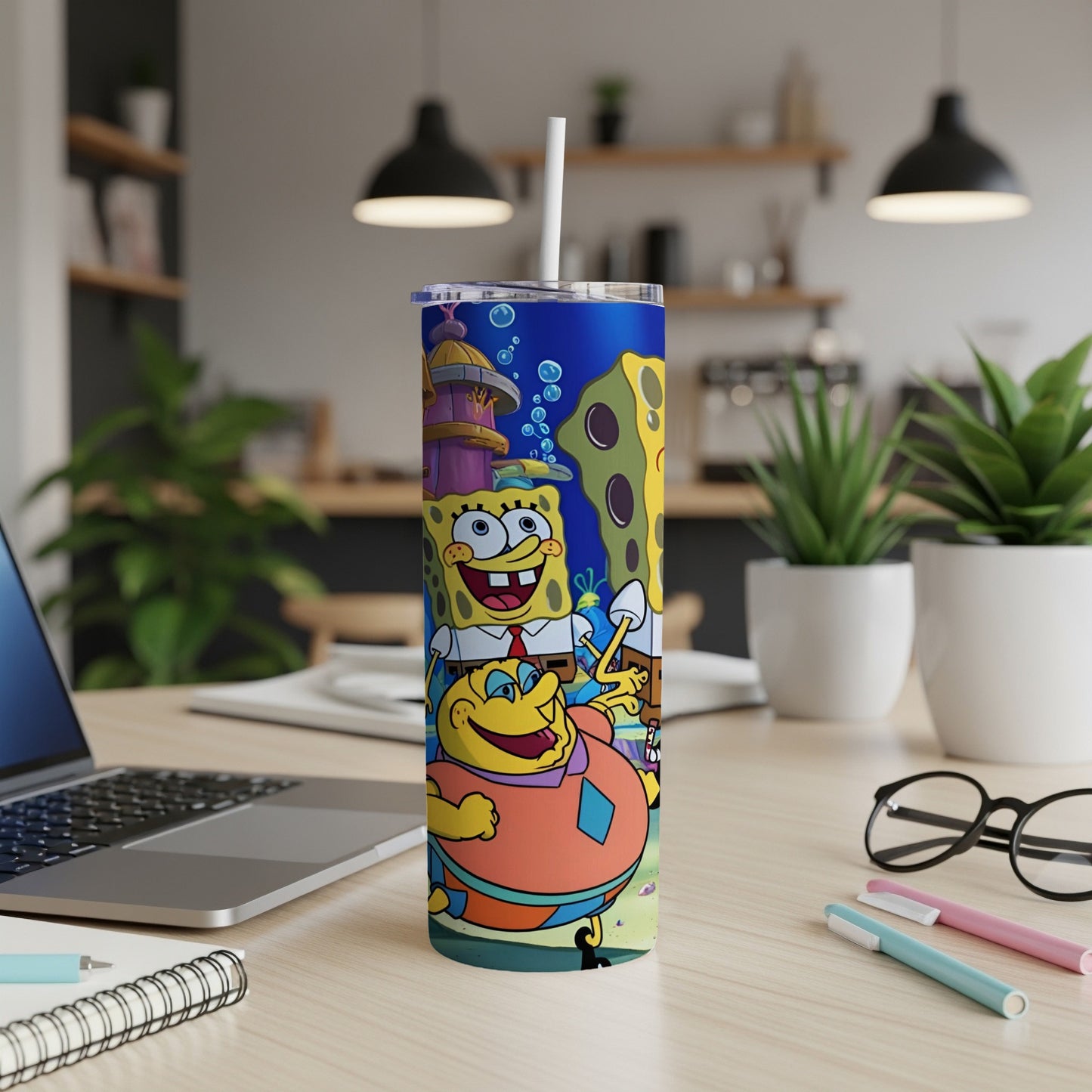 SpongeBob SquarePants and Patrick Star on a blue tumbler with a white straw.
