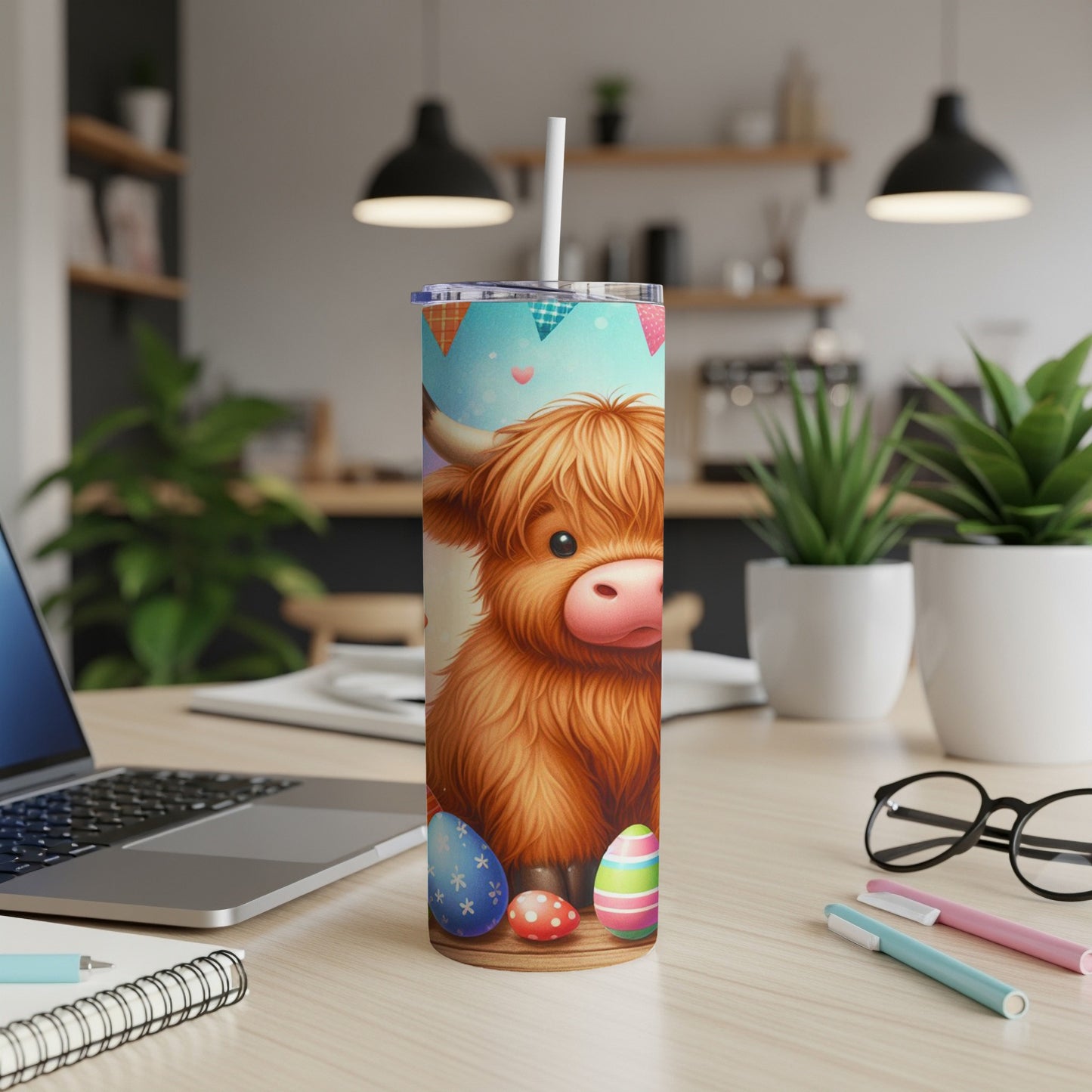 Fluffy highland cow with Easter eggs on a tumbler.