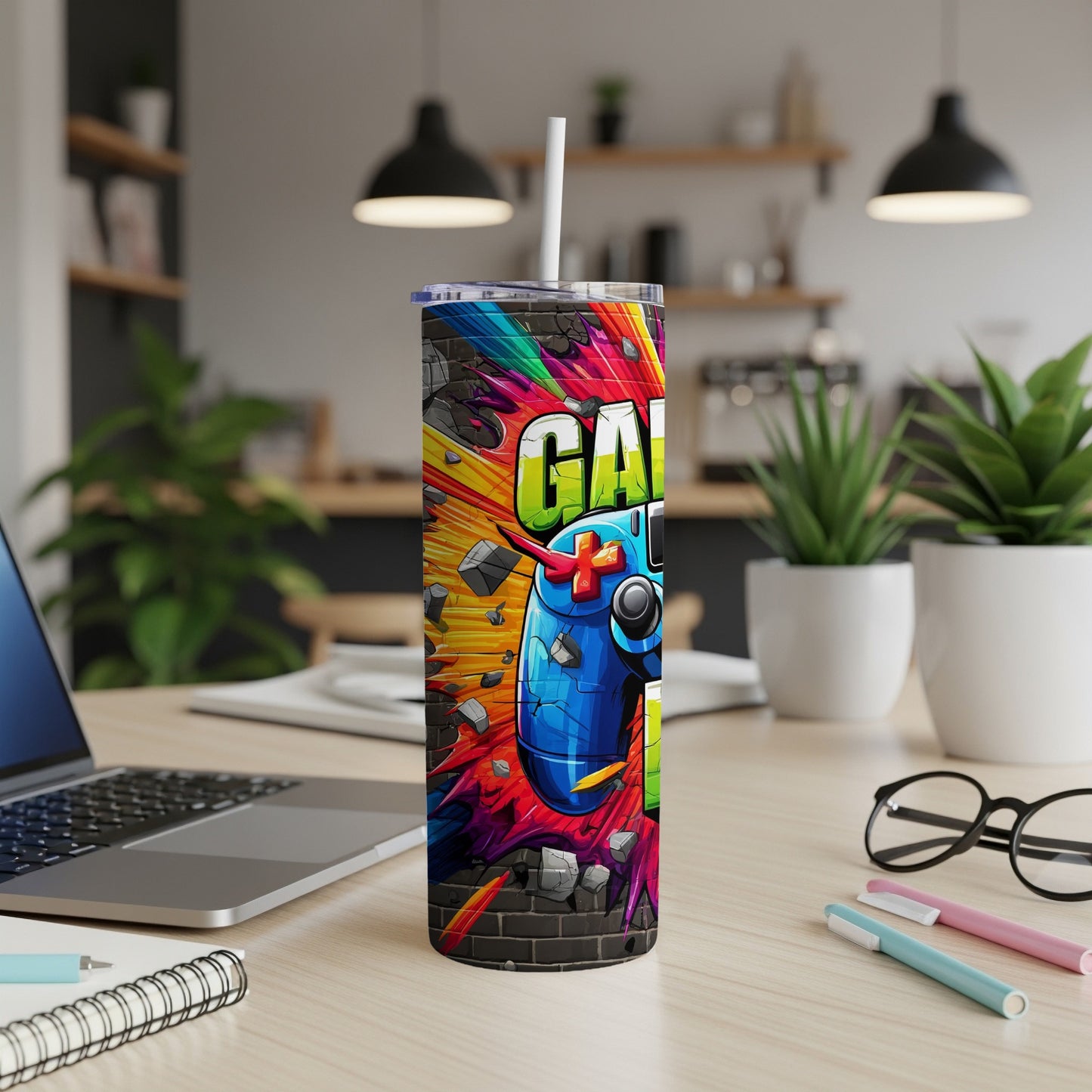 Colorful tumbler with "GAME" text and a video game controller.