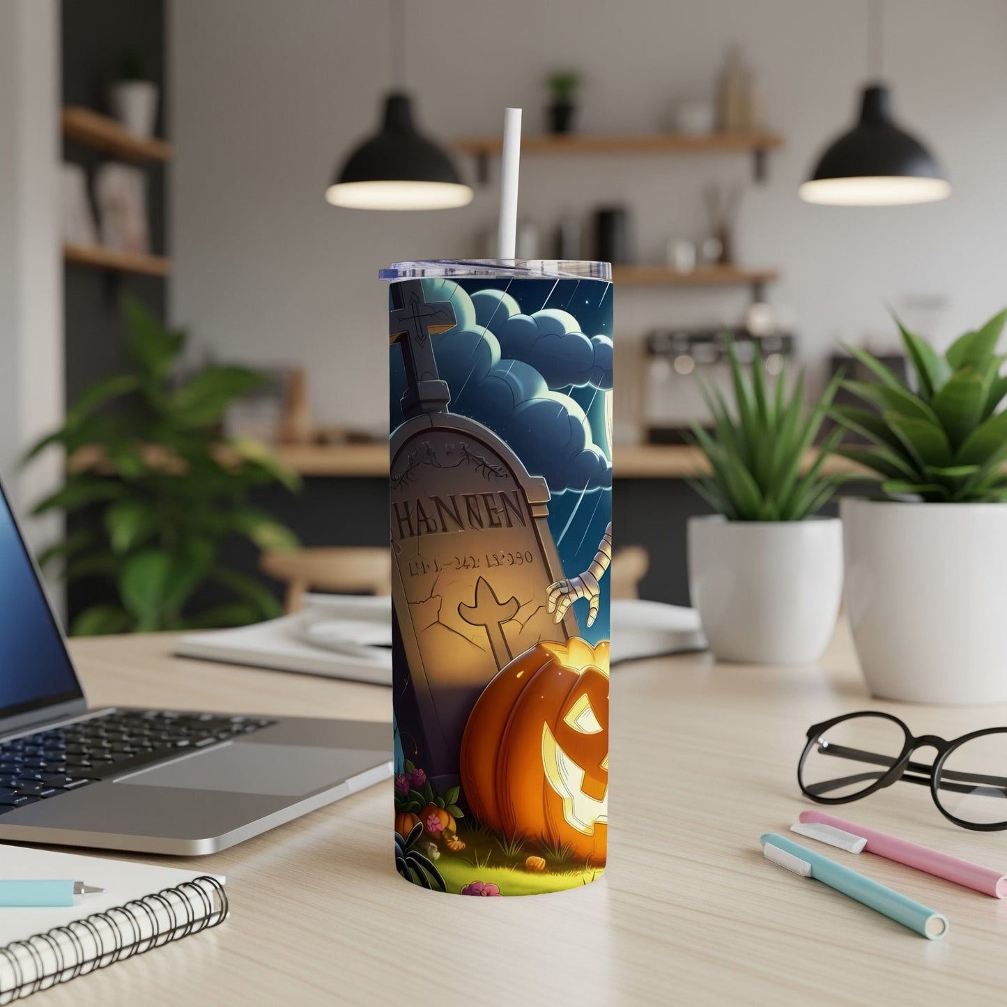Tumbler with Halloween tombstone, pumpkin, and spooky sky design.