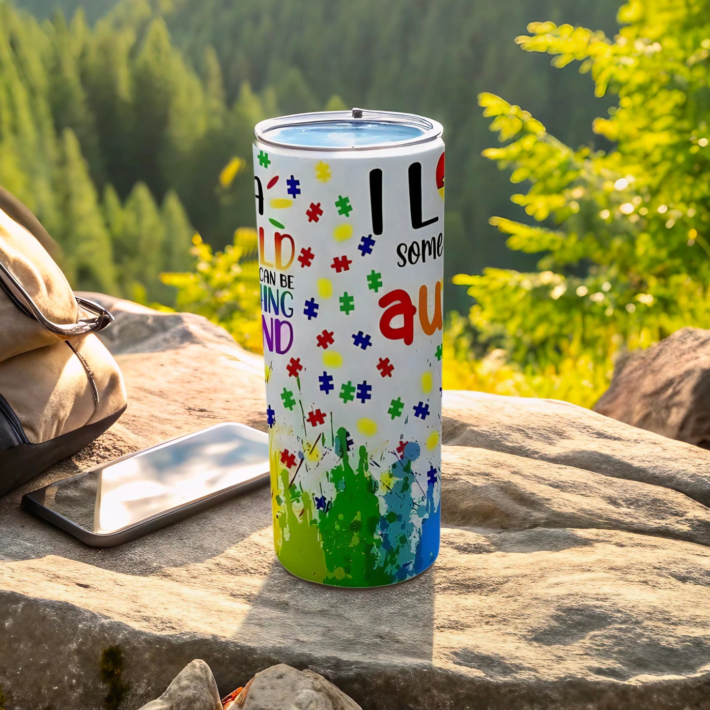"I love something" text on a colorful autism awareness tumbler.