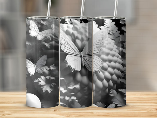 Three tumblers with white butterflies and floral patterns.