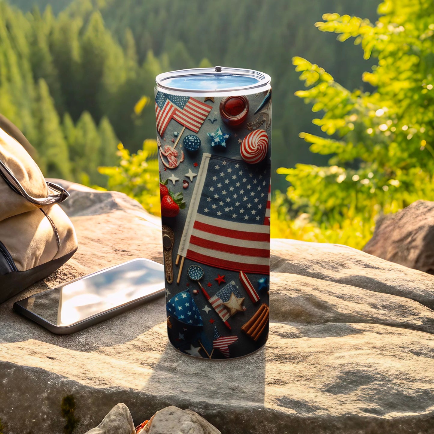 Tumbler with American flag pattern, stars, and candy, on rock outdoors.
