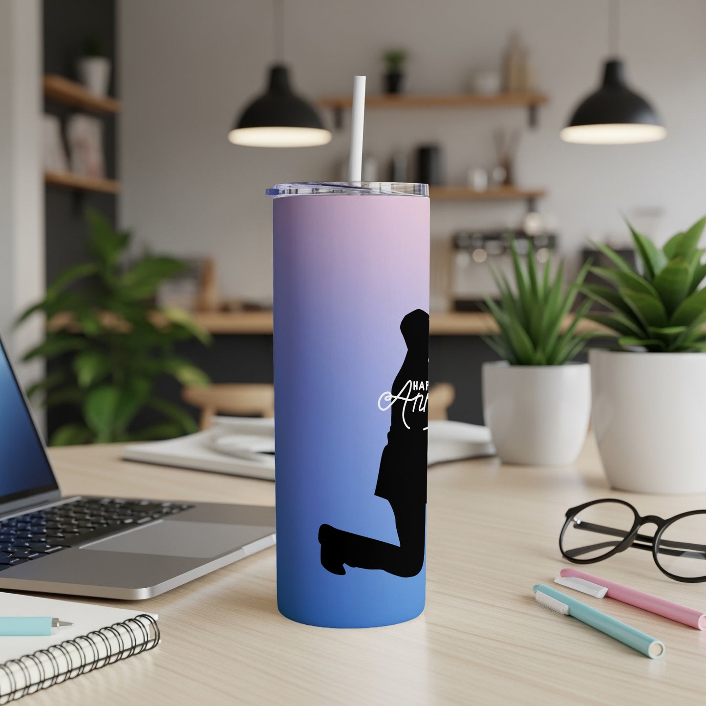Black silhouette of a person jumping on a gradient purple and blue tumbler.