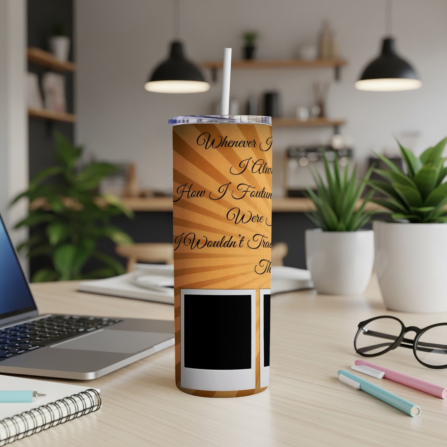 Tumbler with orange sunburst design and text, featuring faux photo frames.