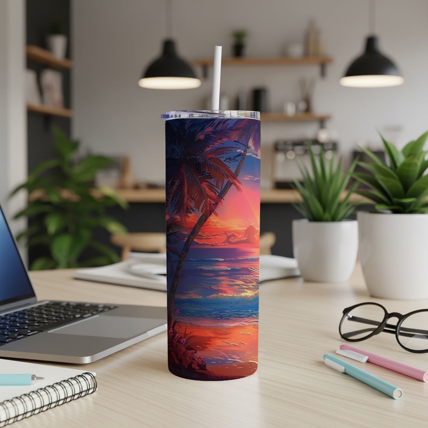 Tropical sunset art on a stainless steel tumbler with straw.
