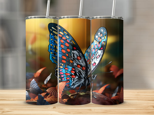 Three tumblers showcasing a vibrantly colored butterfly design with autumnal leaves.