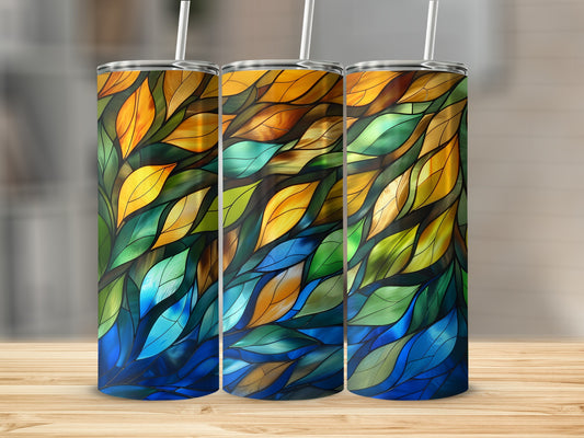 Three tumblers with a stained-glass leaf pattern in shades of blue, green, and orange.