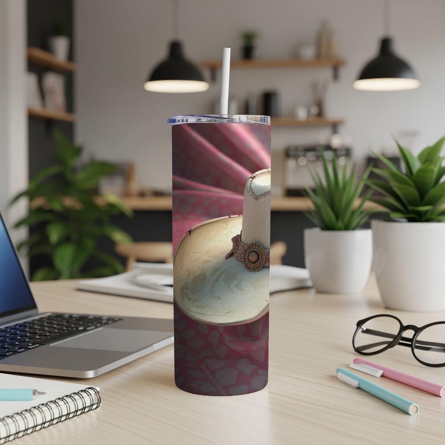 Satin-covered tumbler with a decorative candle on a patterned background.