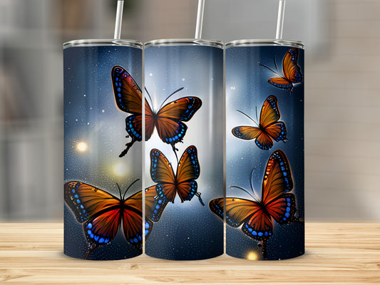 Three tumblers with colorful butterflies and sparkling blue starry background.
