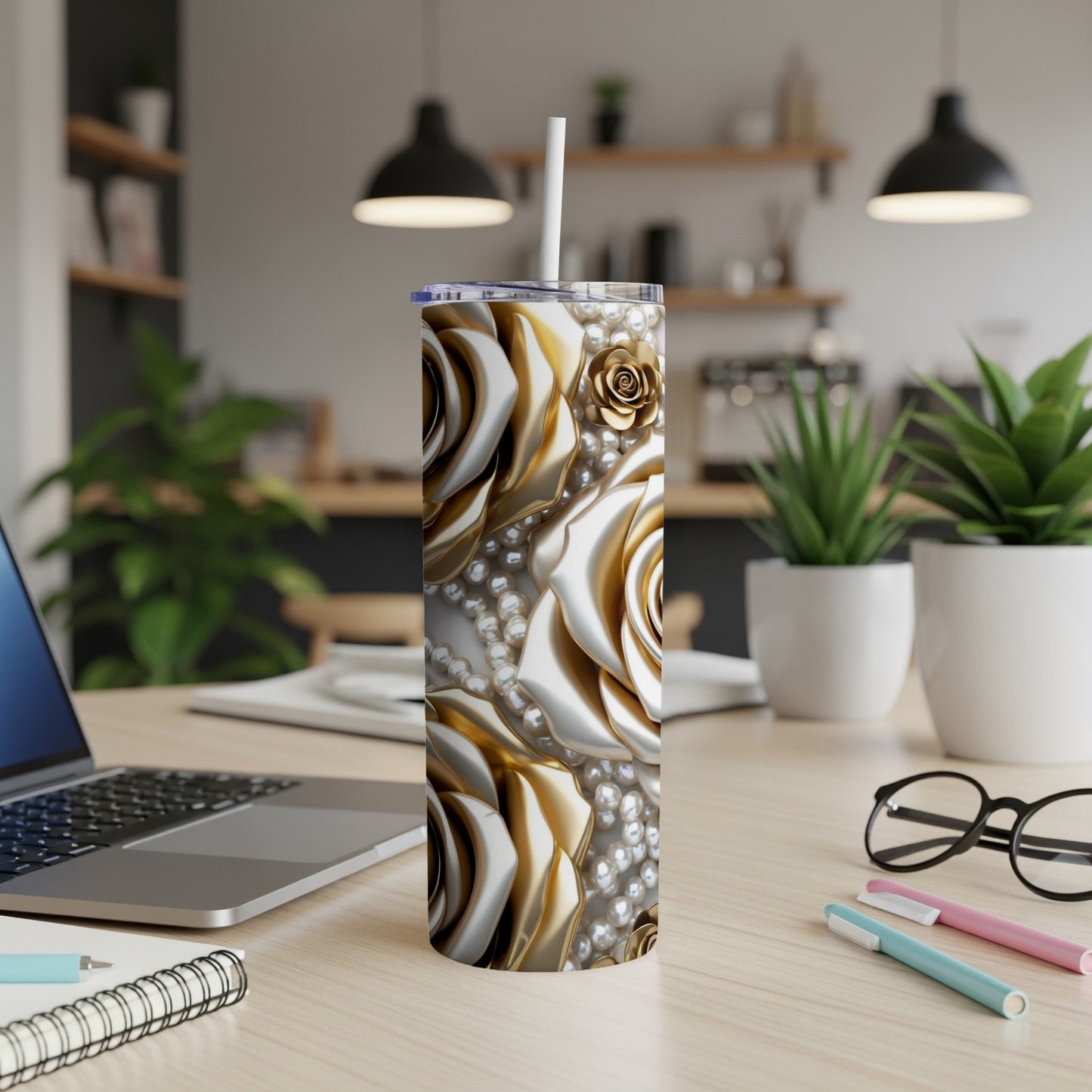 Gold and white rose patterned tumbler with pearls and a straw.