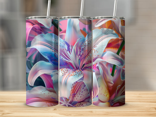 Three tumblers with vibrant lily flower designs, with straws.