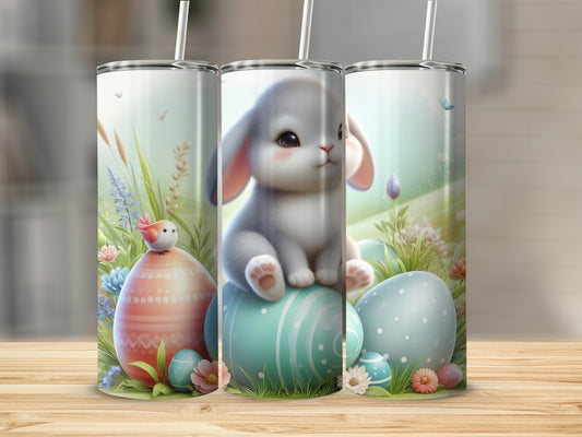 Easter bunny and eggs on pastel backgrounds with straws.