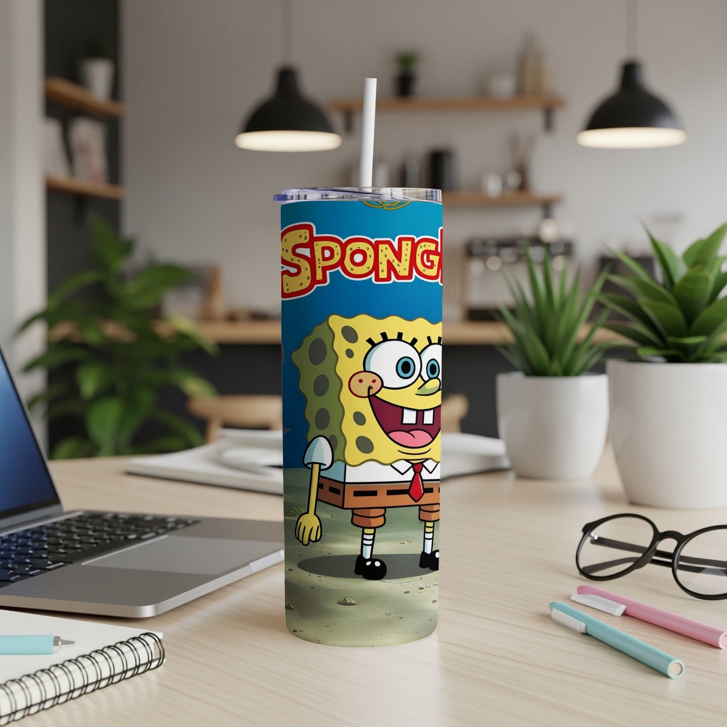 SpongeBob SquarePants themed tumbler with a white lid and straw.