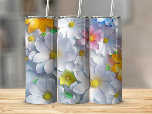 Three tumblers with a floral pattern of white and yellow daisies.