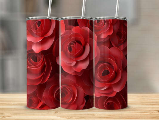 Three red rose tumblers on a wooden surface.
