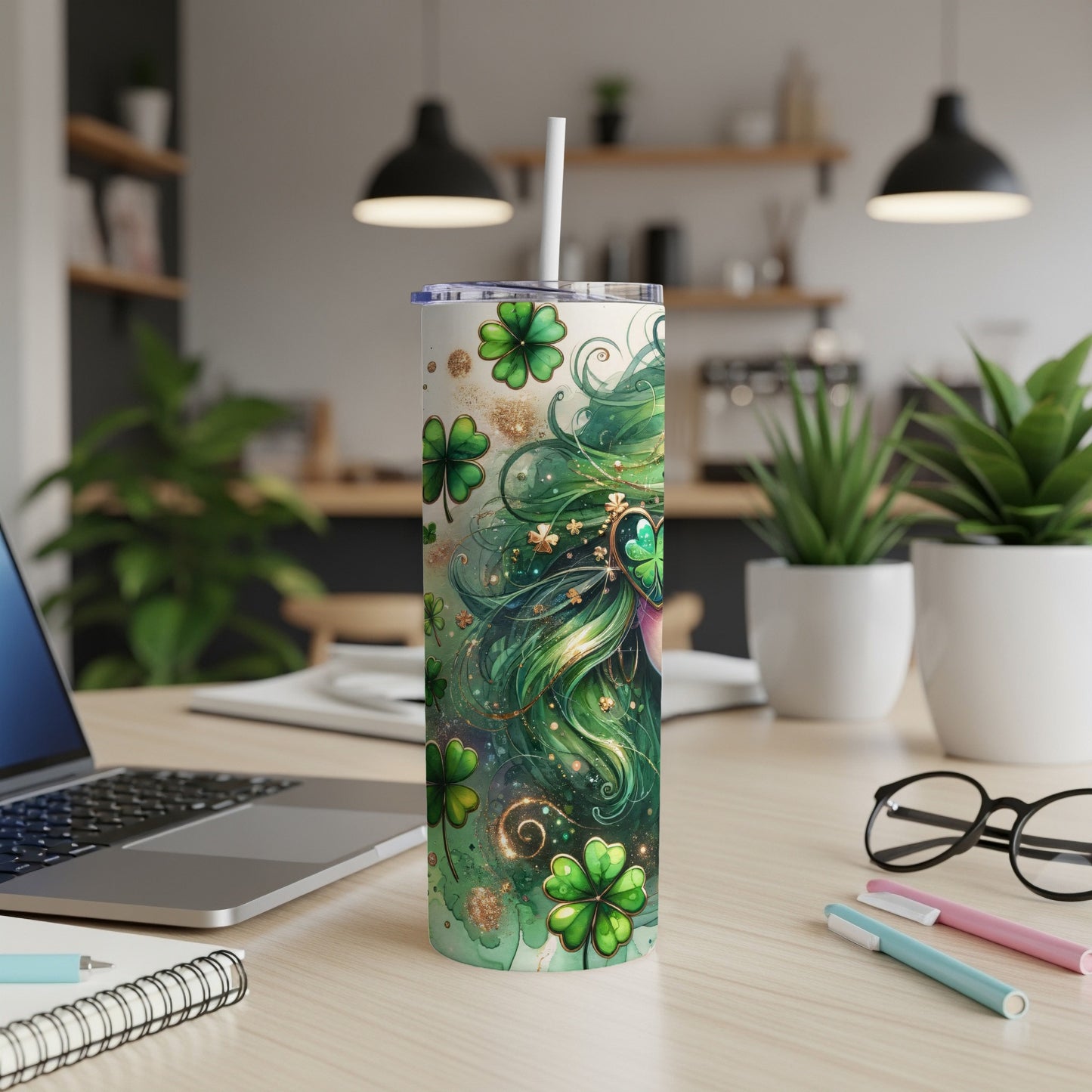Green tumbler with shamrocks and gold accents, straw inserted.