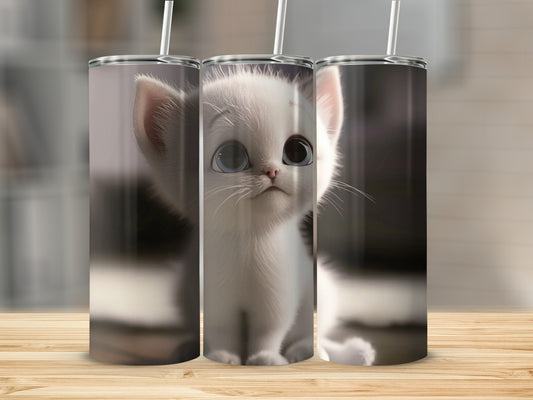 White kitten with large blue eyes on a tumbler.