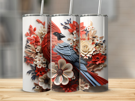 Three white tumblers with cardinal and floral designs on a wooden surface.