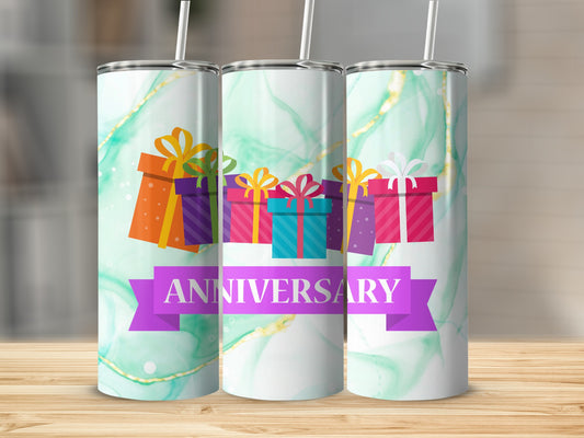 Three tumblers with colorful gift boxes and "Anniversary" ribbon on a marble background.