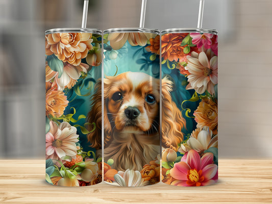 Cavalier King Charles Spaniel portrait surrounded by colorful floral blooms on three tumblers.