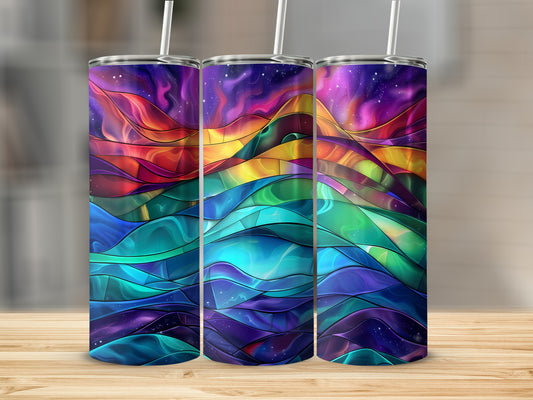 Three tumblers with a colorful, abstract, stained-glass mountain landscape design.