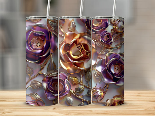 Three metallic rose-themed tumblers with straws on a wooden surface.