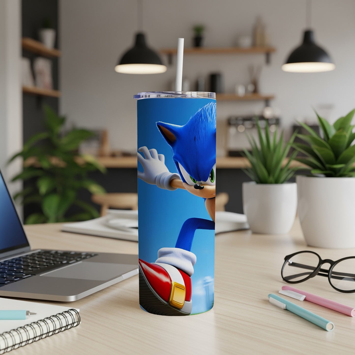 Sonic the Hedgehog running on a blue background, featured on a stainless steel tumbler.